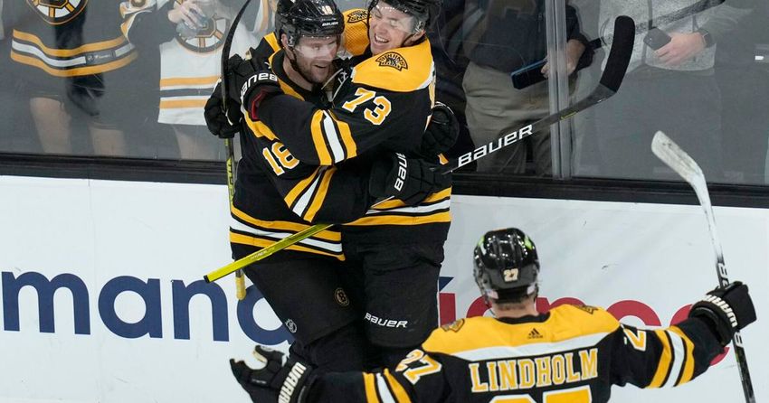  McAvoy scores in season debut, Bruins beat skidding Flames